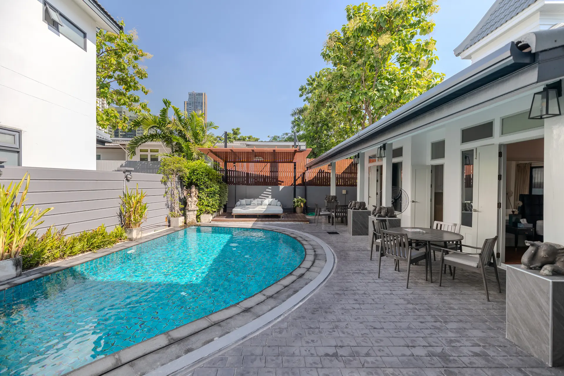 Private swimming pool and Thai-style pavilion with terrace dining at Villa Oasis, Thong Lo, Bangkok