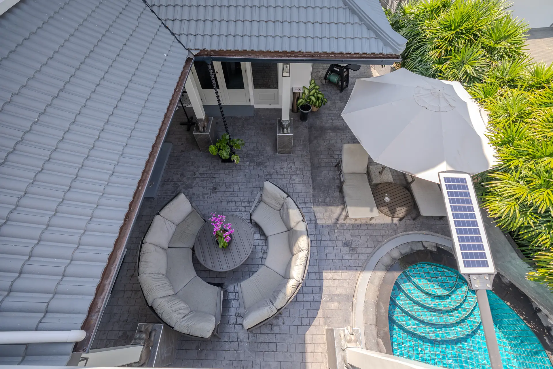 Aerial view of the circular seating area and pool steps at Villa Oasis