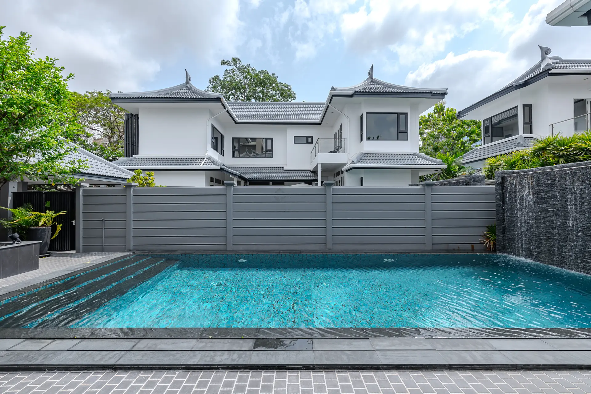 Long private pool with a slate feature wall at Villa Sol
