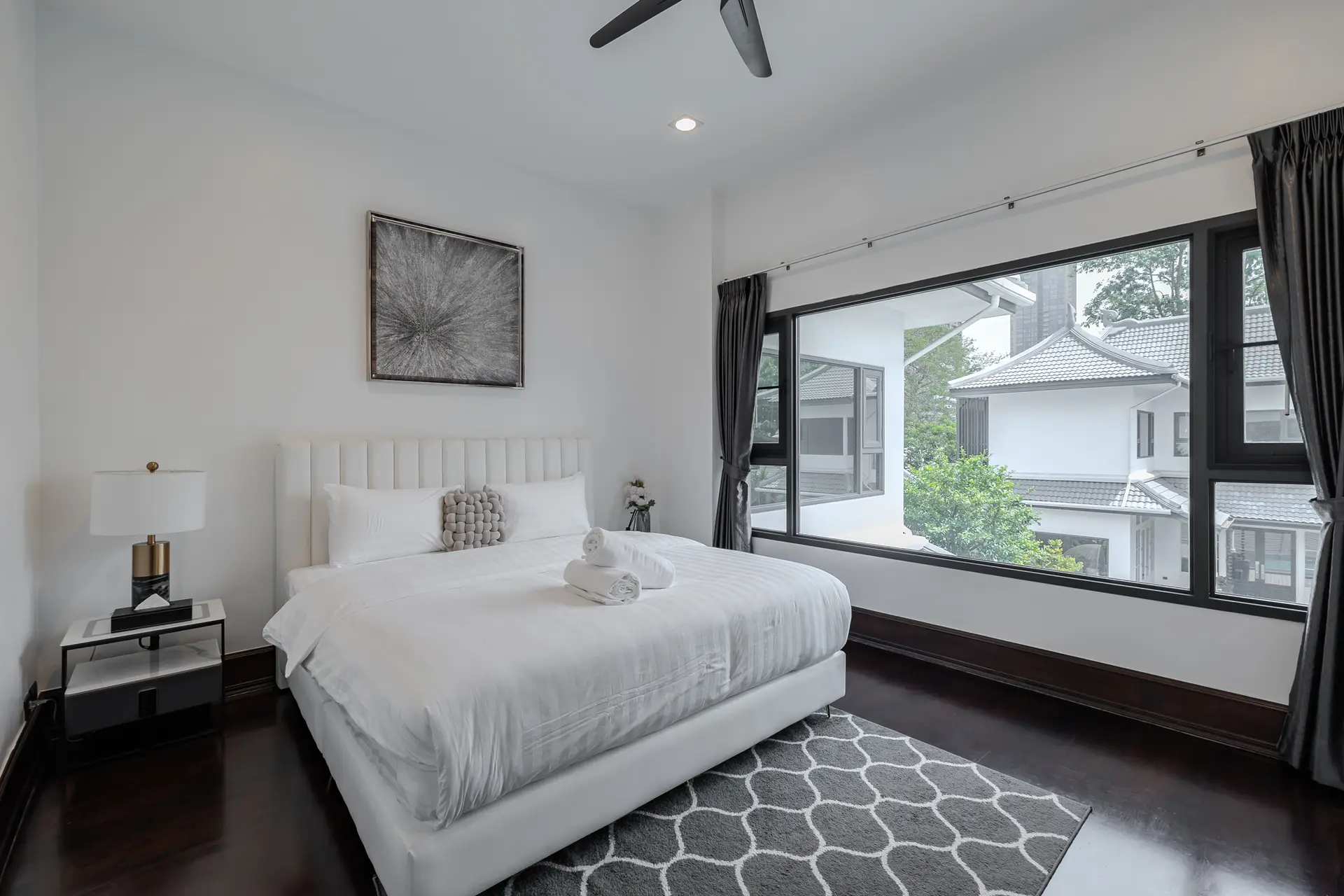 Bedroom with a large window at Villa Sol