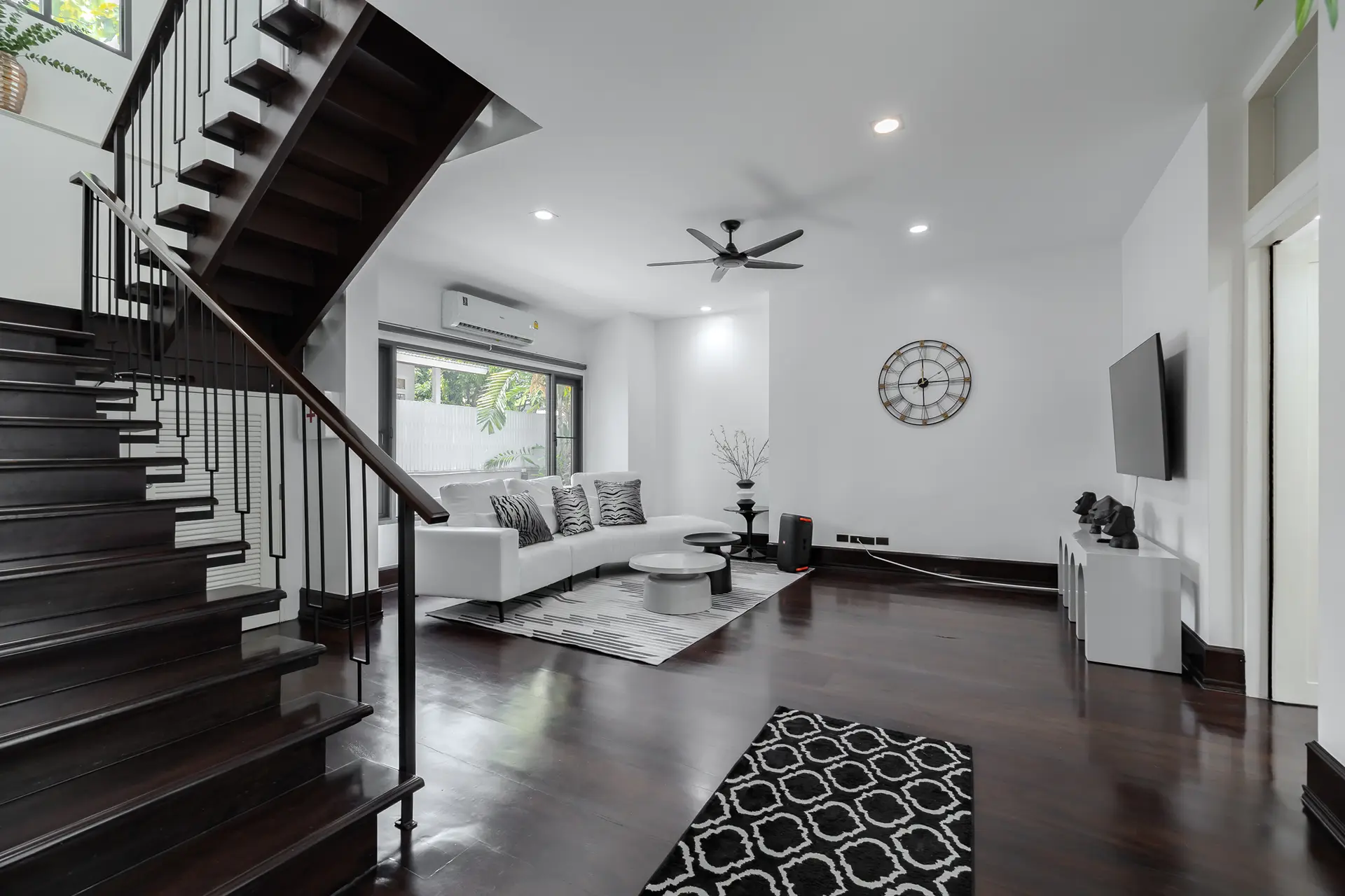 Living area beside the staircase at Villa Noir