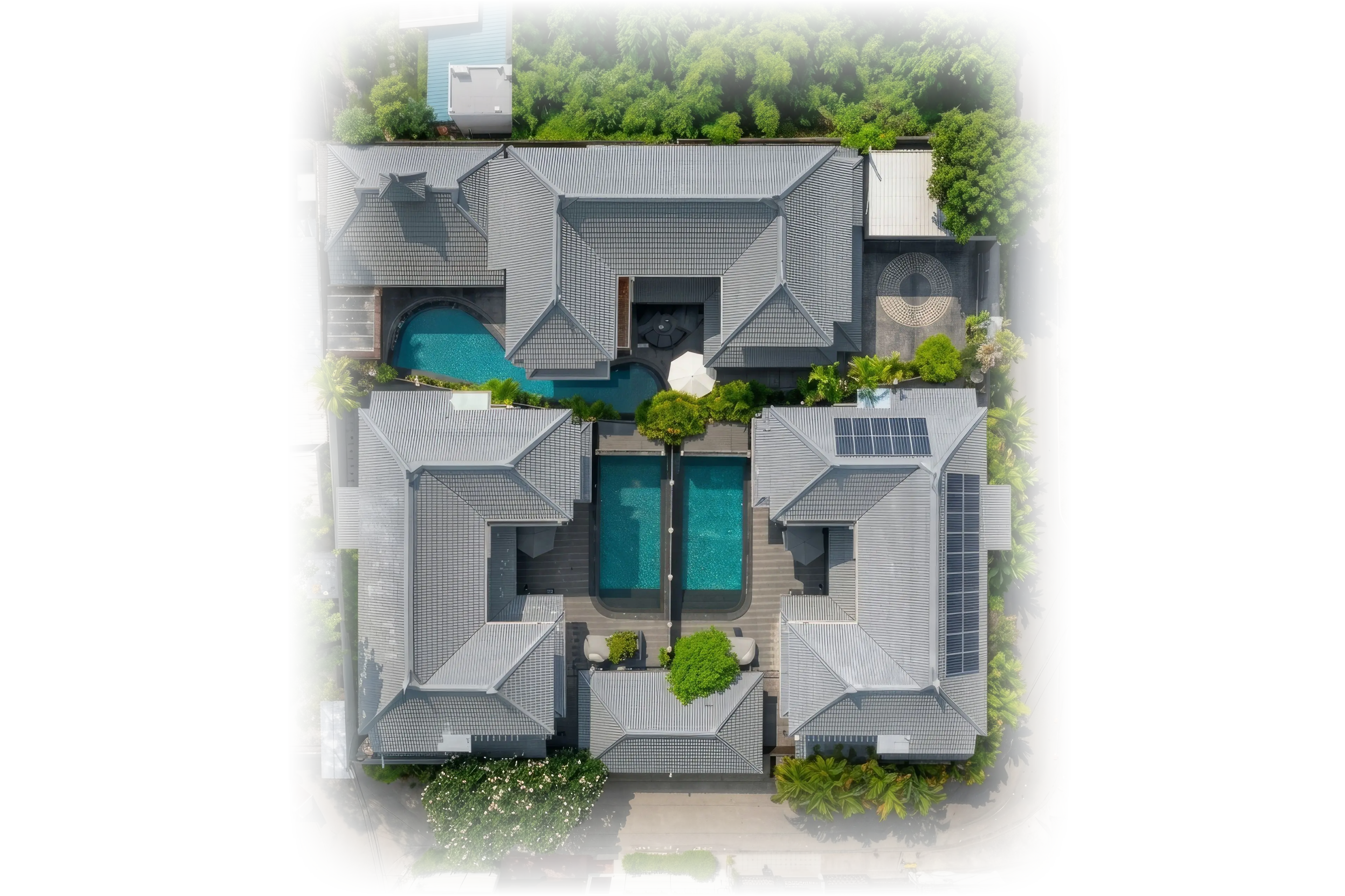 Aerial view straight down on the villa compound in Thong Lo, Bangkok: three large houses around a courtyard with private swimming pools